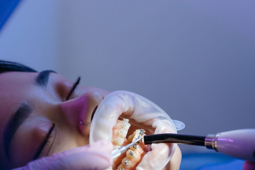 Patient receiving orthodontic treatment from a specialist