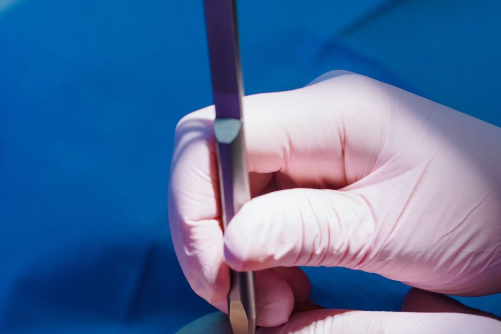 Orthodontist checking braces during orthodontic treatment
