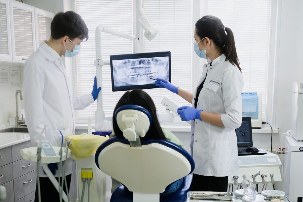 Dental team treating a patient at a modern dental clinic in Dubai