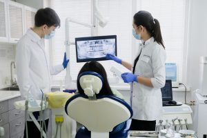 Dental team treating a patient at a modern dental clinic in Dubai